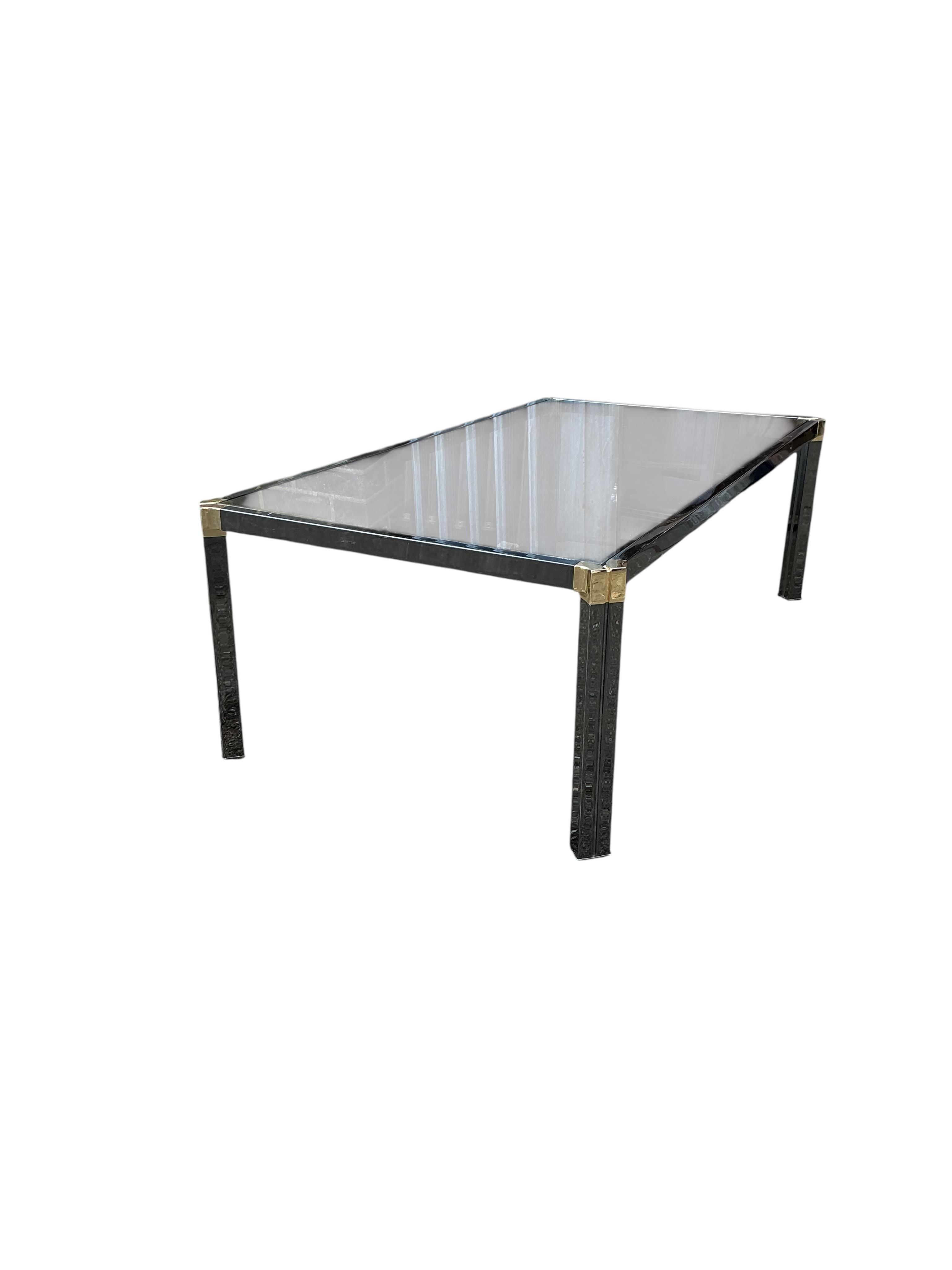 A Pierre Vandel rectangular glass top coffee table. Width 115cm, depth 60cm, height 37cm.